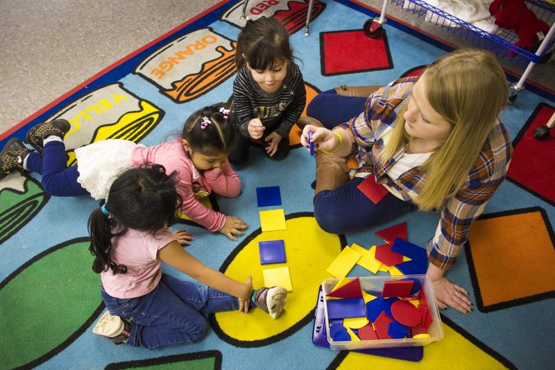 Migrant preschool students learn shapes.