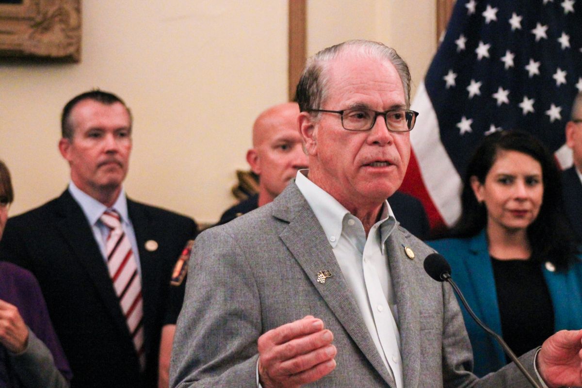 Gov. Mike Braun addressed reporters at a ceremonial bill signing on May 28, 2025. Over his shoulder is Sen. Aaron Freeman (R-Indianapolis)