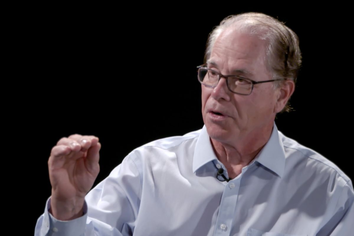 A screenshot from a video interview with Mike Braun. Braun is a White man, balding with dark, graying hair. He is wearing glasses and a light blue shirt.