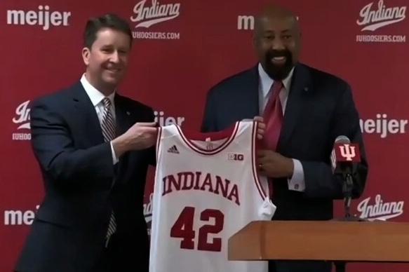 Indiana athletic director Scott Dolson and new head basketball coach Mike Woodson hold up Woodson's old IU jersey.