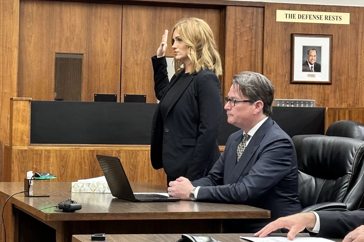 Misty Noel raising her right hand
