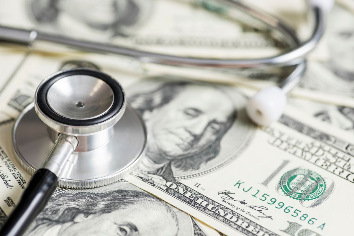 Stethoscope on the dollars. Medical costs. Healthcare payment concept