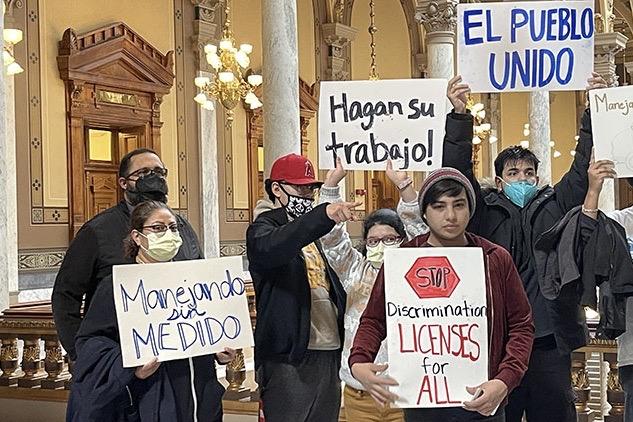 Members of immigrant rights activist group Movimiento Cosecha demonstrated at the Statehouse on Wednesday.