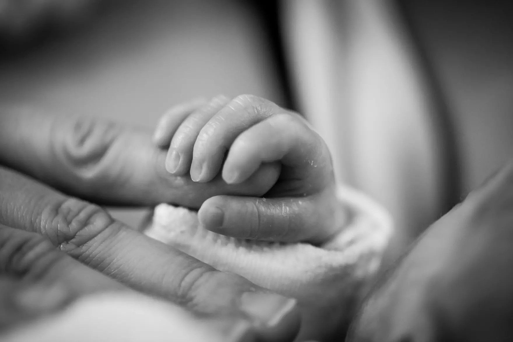 baby childbirth hand macro black and white