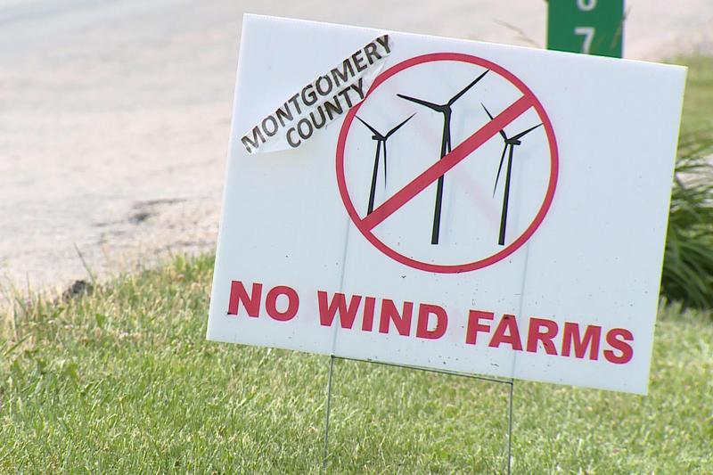 A sign advocating against wind turbines.