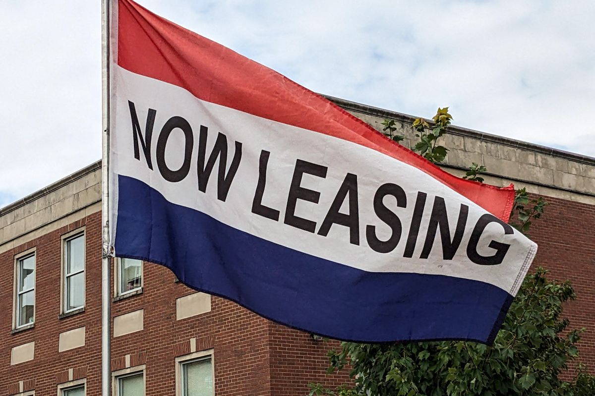 "now leasing" red white and blue flag