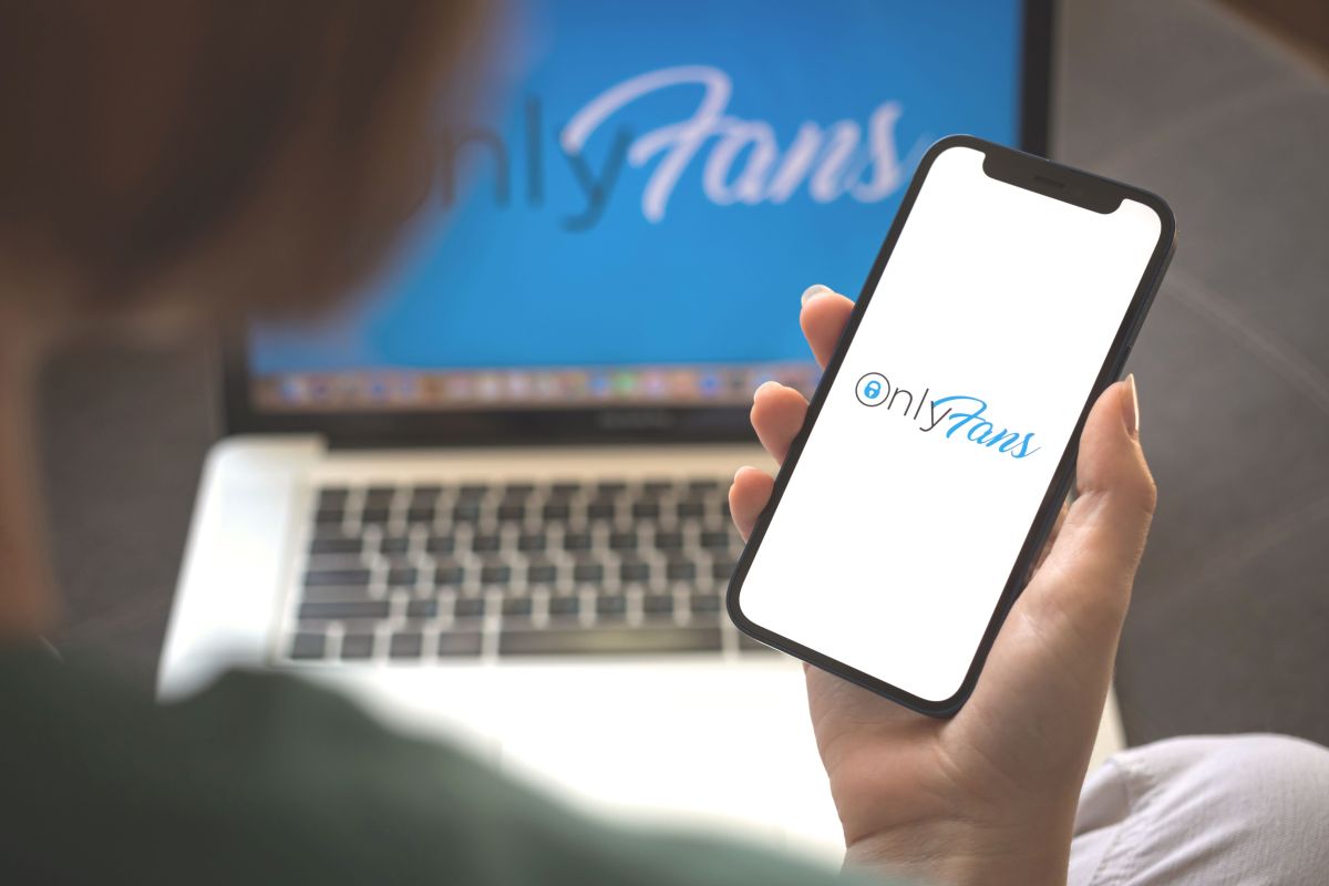 Onlyfans logo on phone and laptop