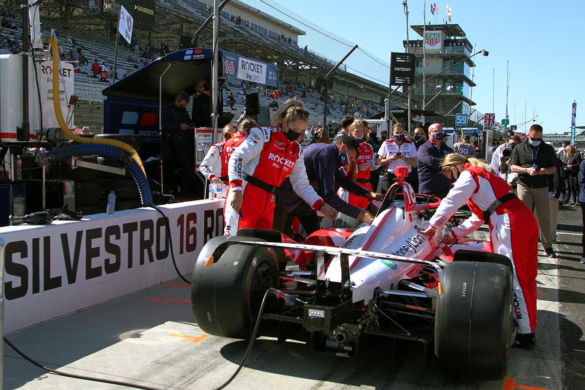 Paretta crew members prepare the team's car for the 105th running of the Indianapolis 500. 