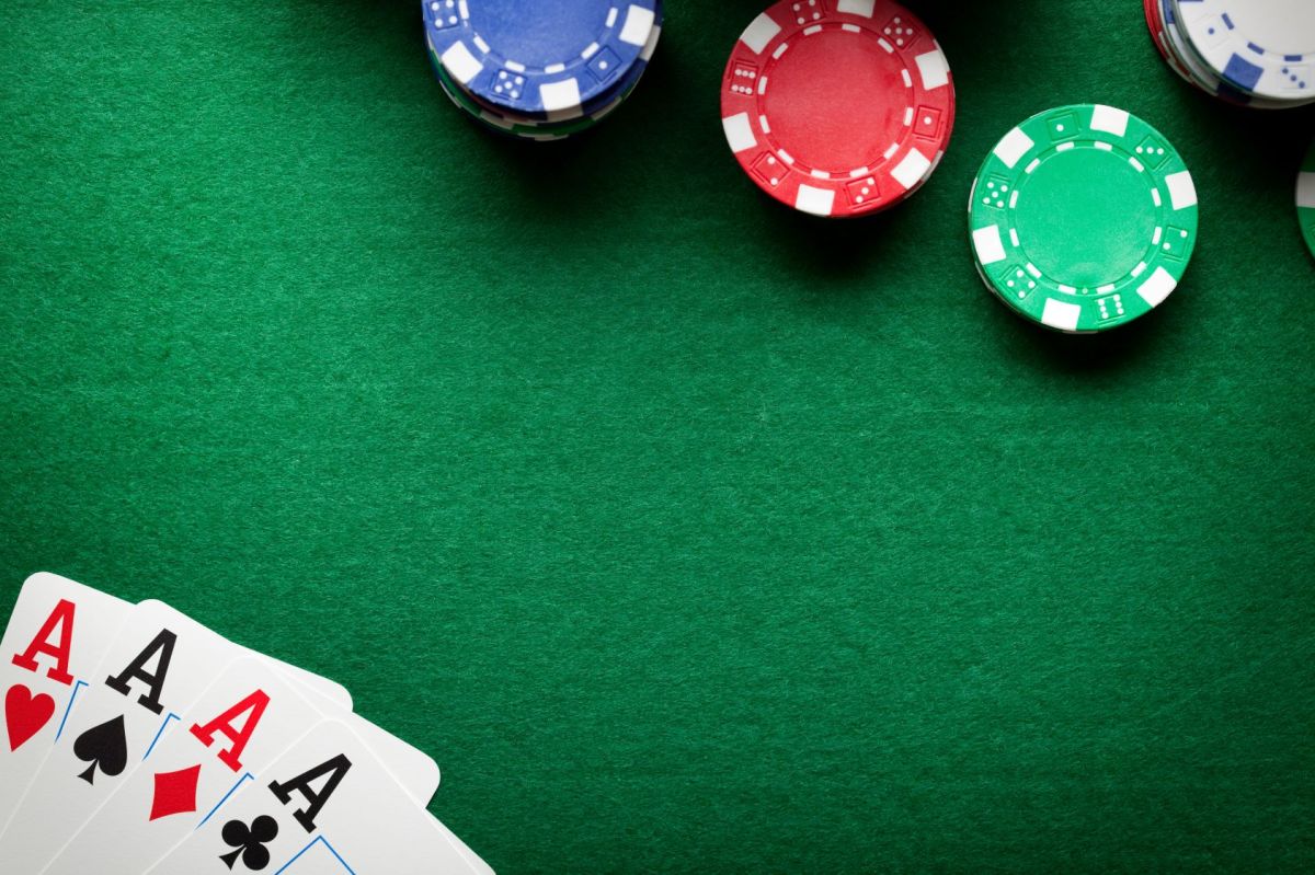 Poker background - chips and cards on green table