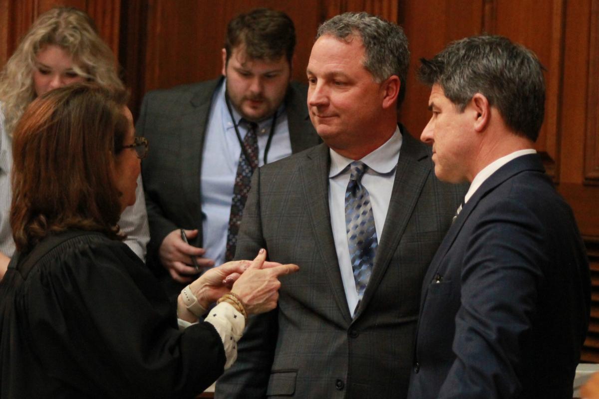 Indiana House Speaker Todd Huston (R-Fishers), center, and Senate President Pro Tem Rodric Bray (R-Martinsville), right, speak with Indiana Chief Justice Loretta Rush, left on the House floor prior to the State of the State address on Jan. 10, 2023.