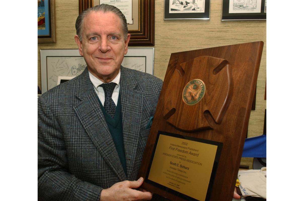 Former Herald-Times owner Scott Schurz holds an HSPA 2002 award, April 2003.