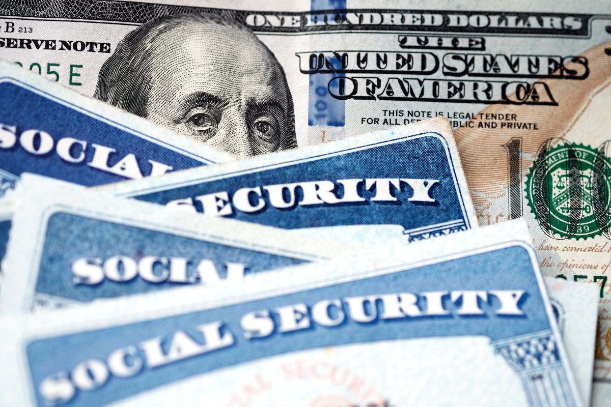 Social Security Cards with US One Hundred Dollar Bill $100