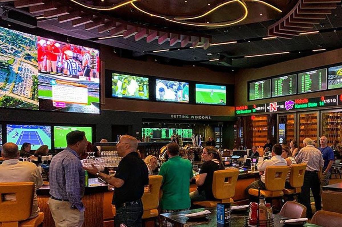 A generic photo of people at a casino (gambling, betting, sports betting)