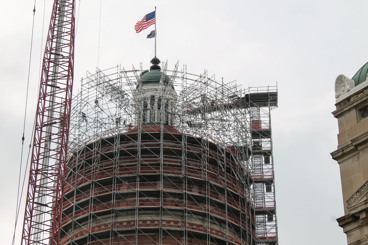 The Statehouse cupola surrounded by scaffolding.