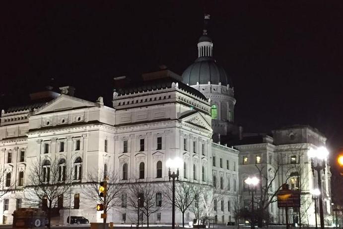 An exterior view of the Indiana Statehouse at night. 