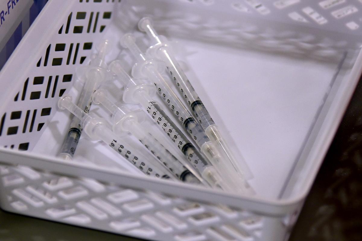 A photo of syringes in a basket.