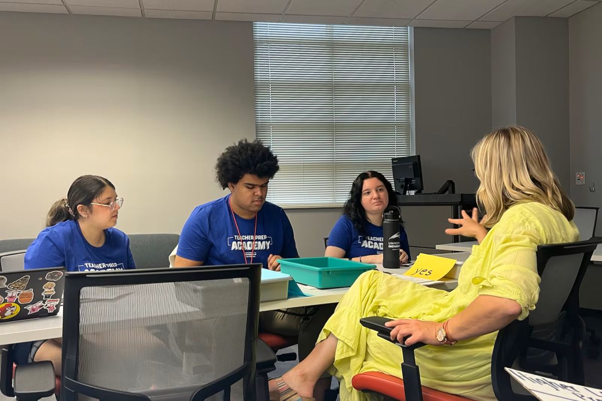 Brooke Hamlett works with students at the Teacher Prep Academy on Thursday, June 5, 2025 in Indianapolis. The program aims to help high schoolers explore possible careers in teaching through dual-credit courses, and by living on the University of Ind