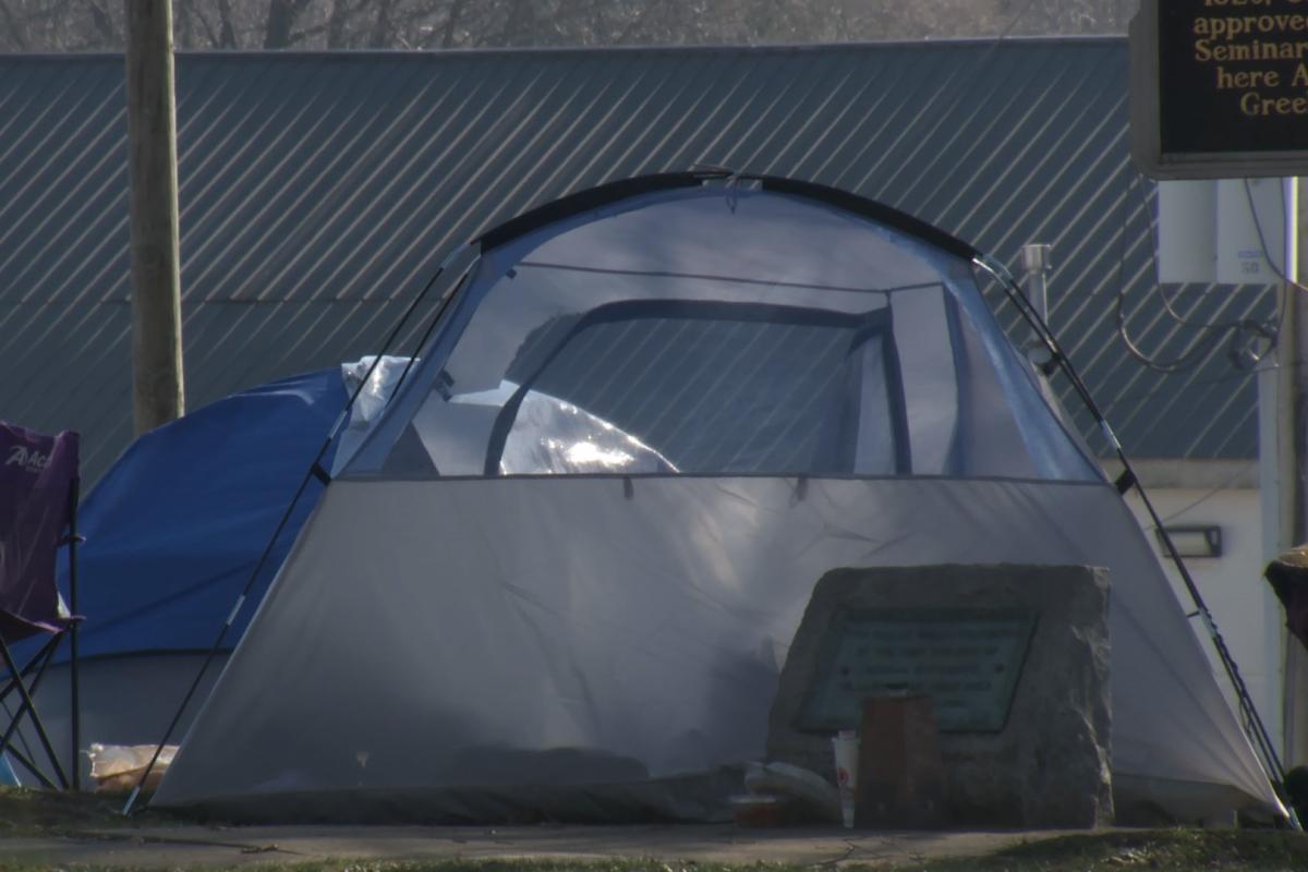 A photo of a tent set up in Bloomington's Seminary Park.