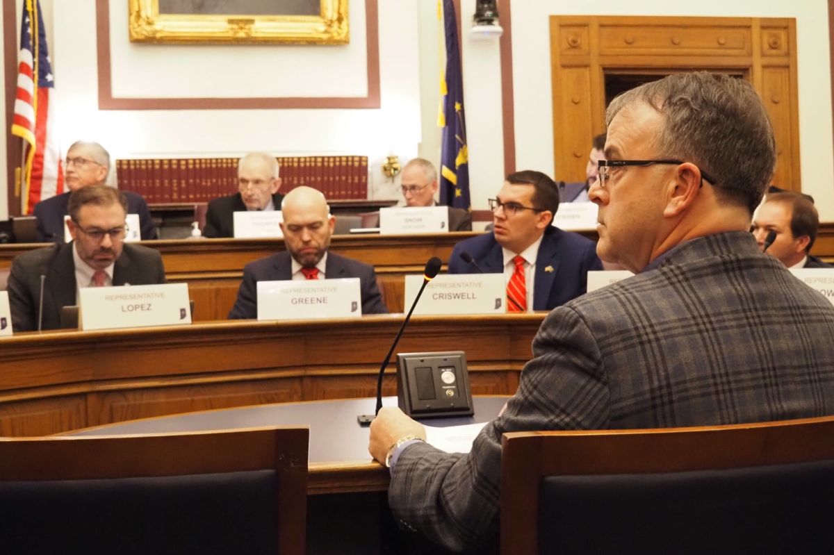 Terry Spradlin, the executive director of the Indiana School Boards Association, listens to a Ways and Means committee member on Feb. 6, 2025.