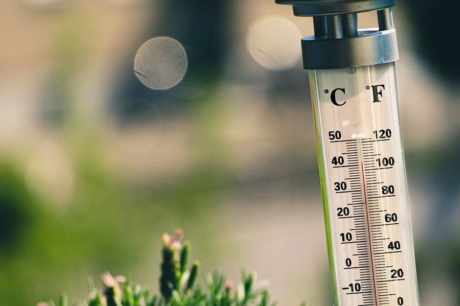 A stock image of a thermometer showing hot weather.