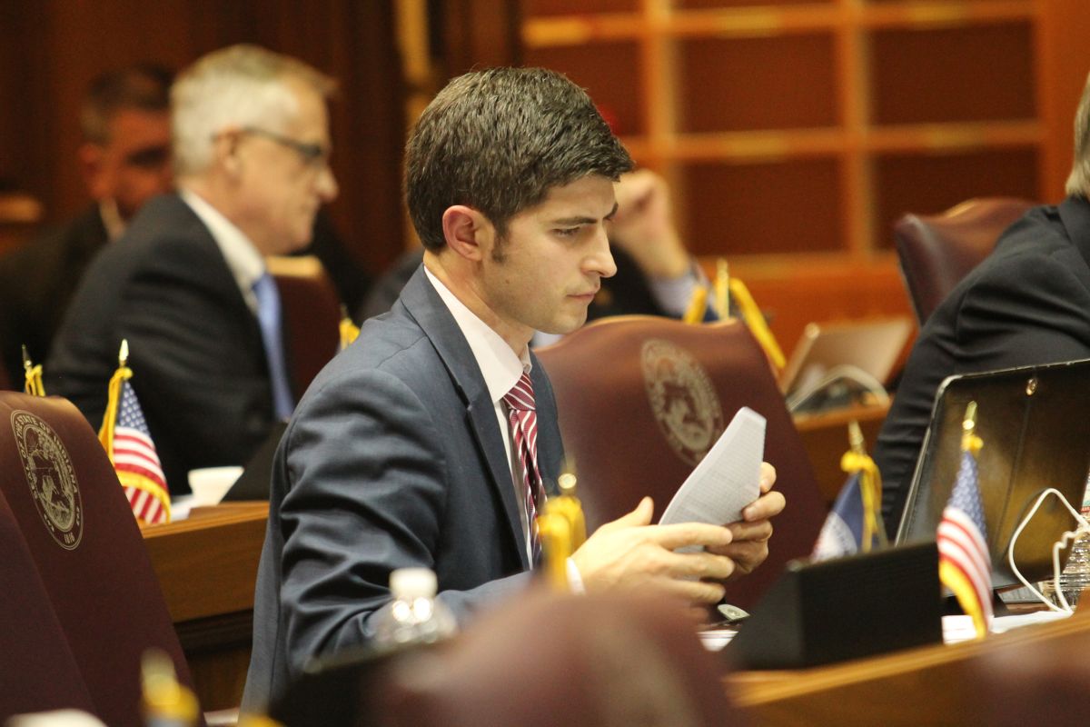 Tim Wesco sits behind his desk on the Indiana House floor.