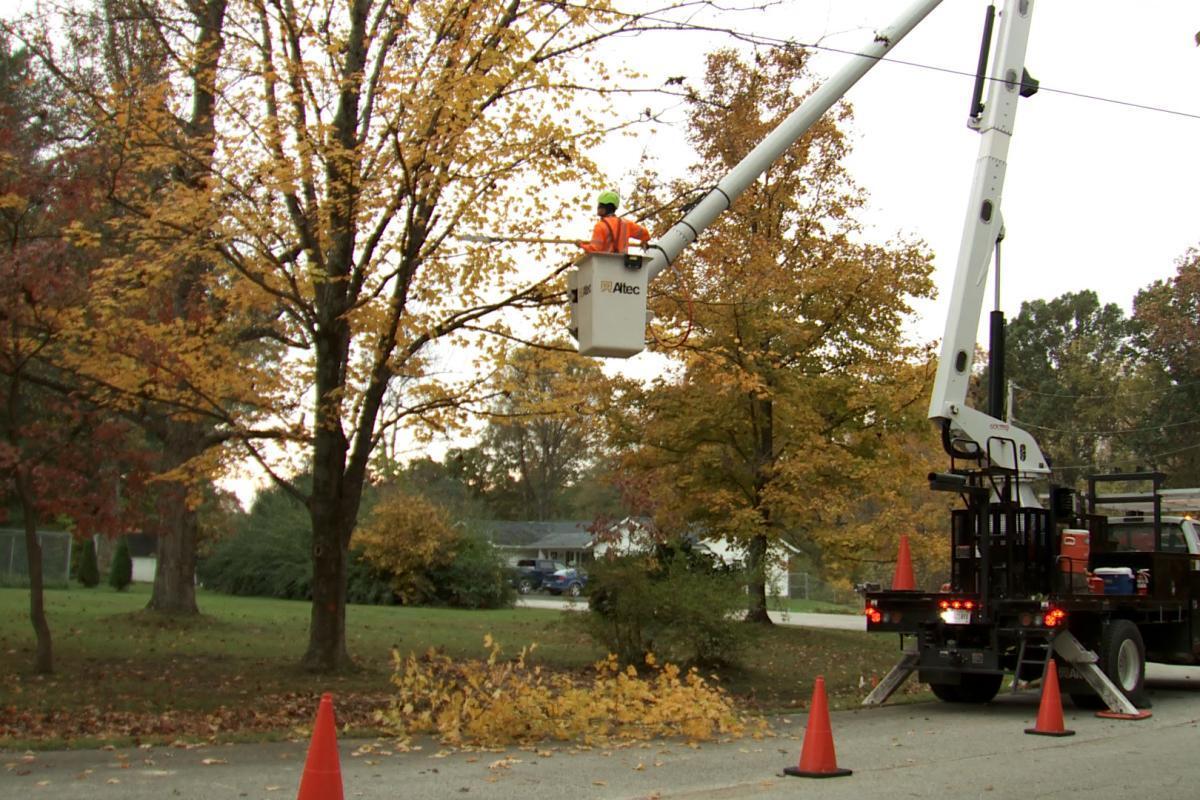 A crew with the Utilities District of Western Indiana REMC does a maintenance trim on trees.
