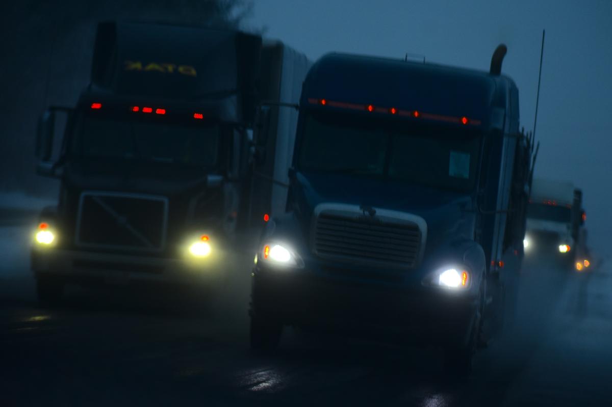 trucks_driving_in_dark