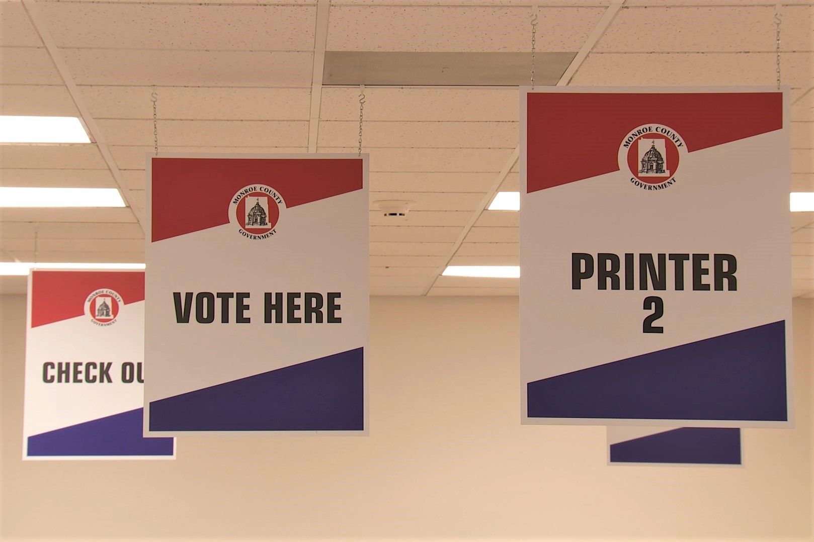 Signs at a polling location that say "vote here" during the 2019 Monroe County municipal elections.