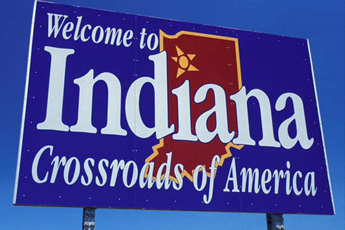 the welcome to indiana road sign