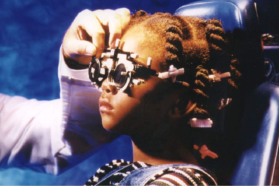 A child receiving an eye exam.