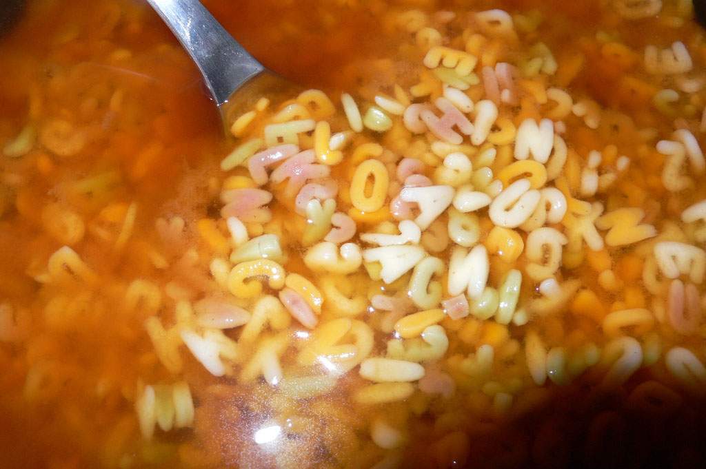 Alphabet soup with spoon