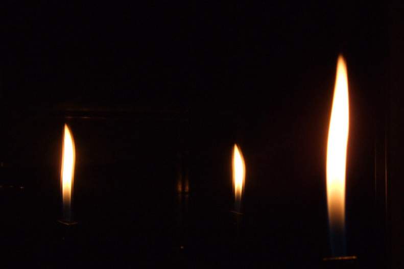 Lit Candle in Dark