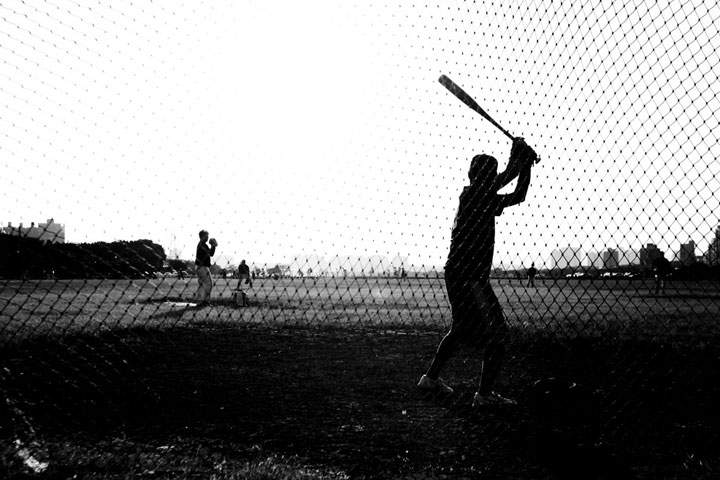 black and white photo of two kids playing baseball
