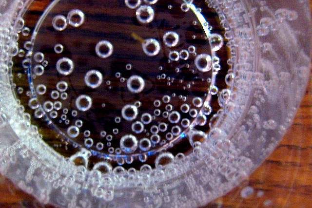 looking down at a glass with carbonation