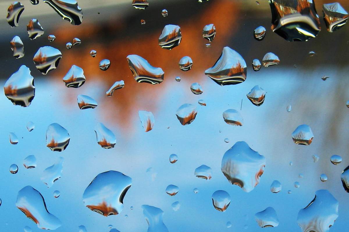 raindrops on the roof of a car