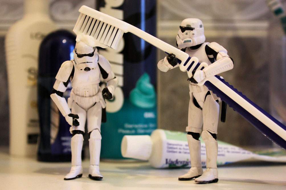 Star Wars storm troopers using a large toothbrush