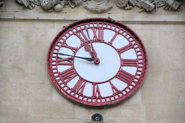 old clock on a wall in Greenwich, London