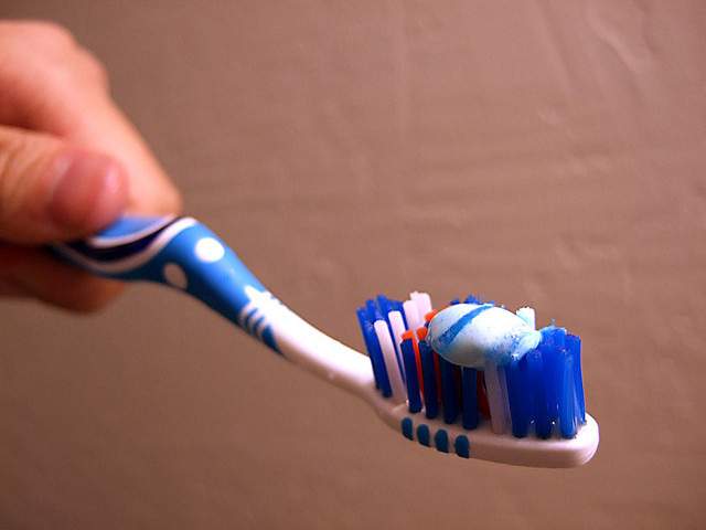 toothbrush with toothpaste on it