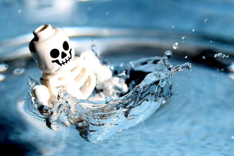 A Lego skeleton splashes down in water