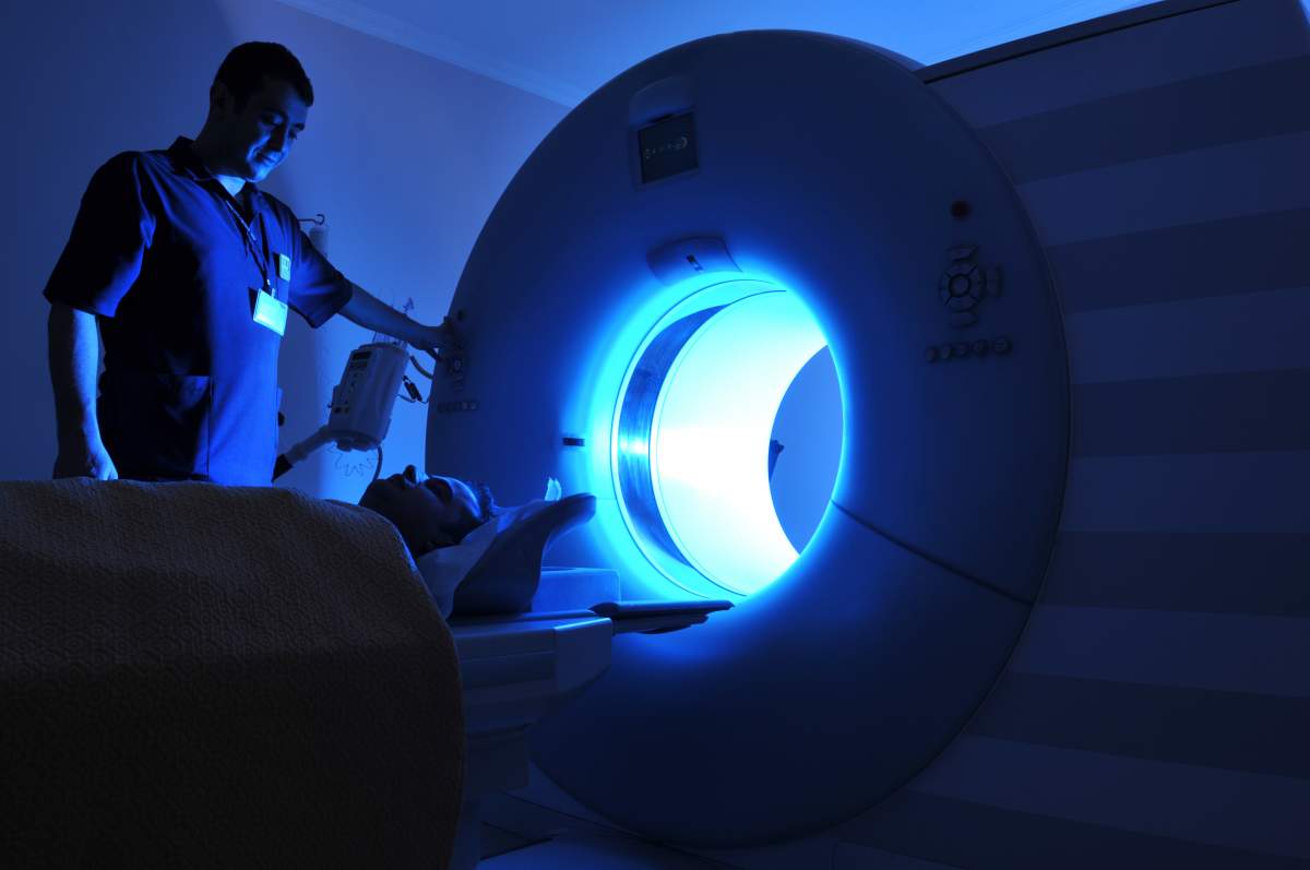 a tech instructs patient before MRI procedure