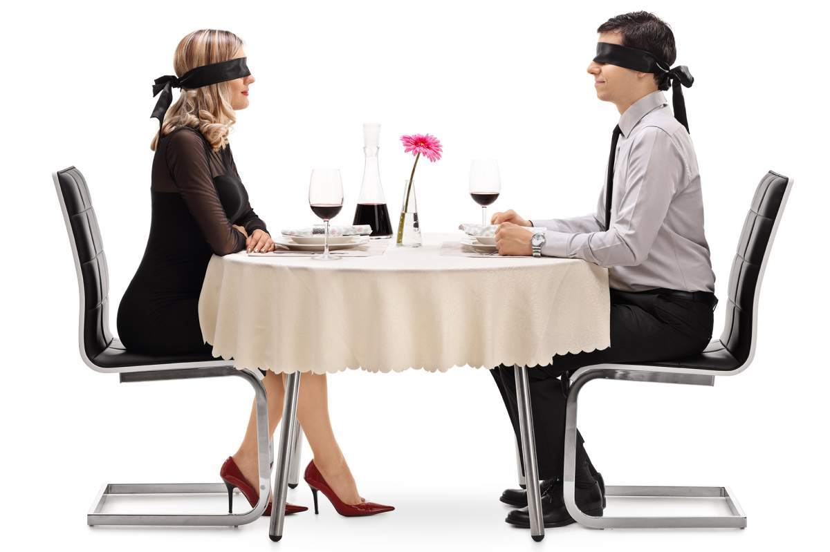 blindfolded couple on date