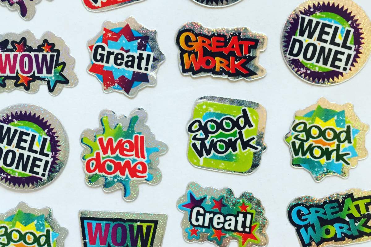 Brightly colored stickers that are meant to praise the recipient. Phrases include: "great" and "good work."