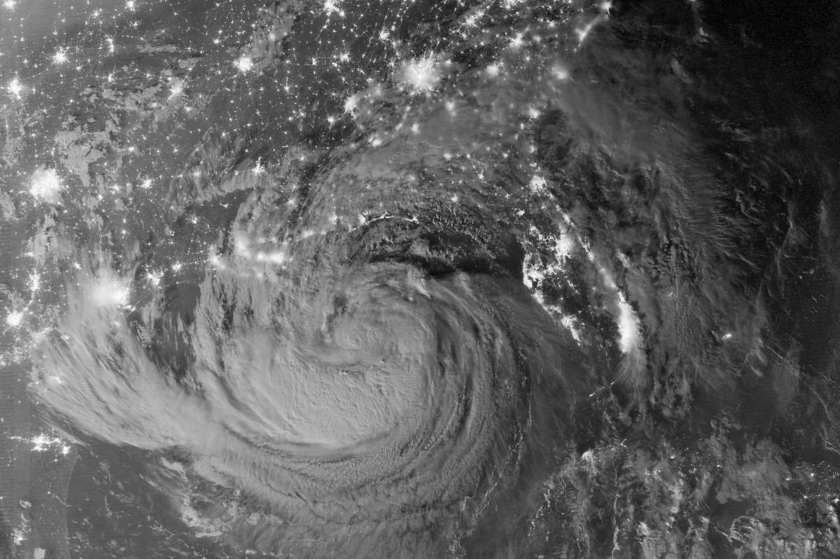 A black and white photo of a hurricane taken from space