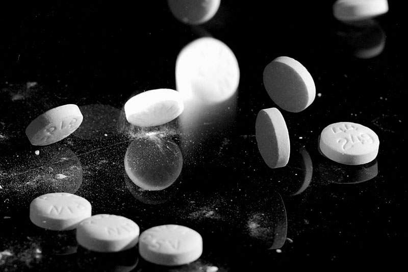 a black and white image of aspirin pills
