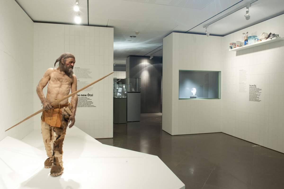 a museum exhibit featuring a reconstruction of Ötzi