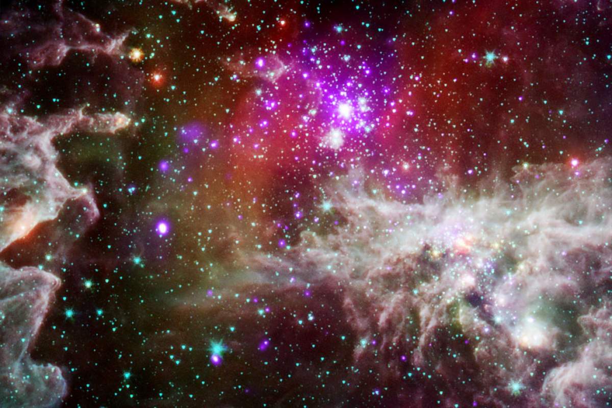 From Harvard-Smithsonian Center for Astrophysics: "NGC 281 is known informally as the "Pacman Nebula" because of its appearance in optical images. In optical images the "mouth" of the Pacman character appears dark because of obscuration by dust and gas, but in the infrared Spitzer image the dust in this region glows brightly."
