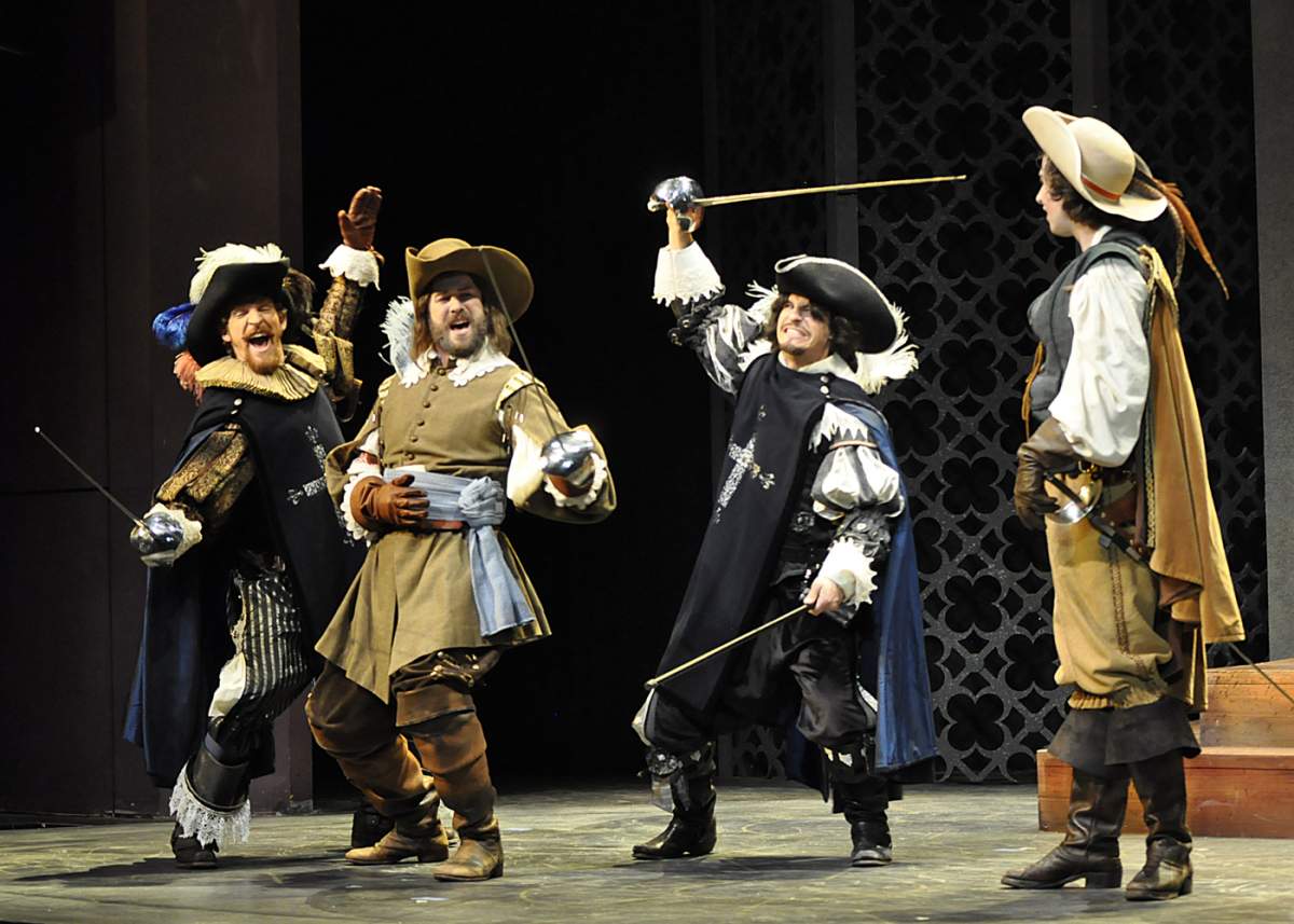 three musketeers caraouse as D'Artagnan observes