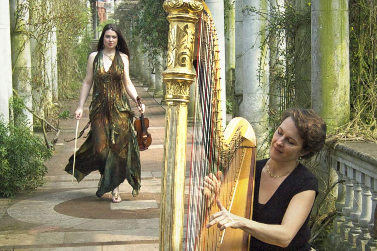 violinist approaches harpist