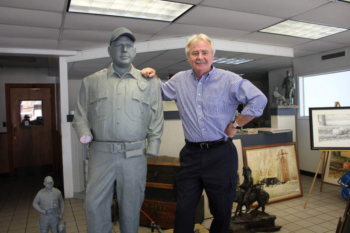 Wolfe with his statue of officer long