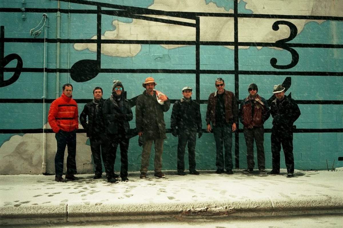 A photo of the band Black Swans standing outside in the snow